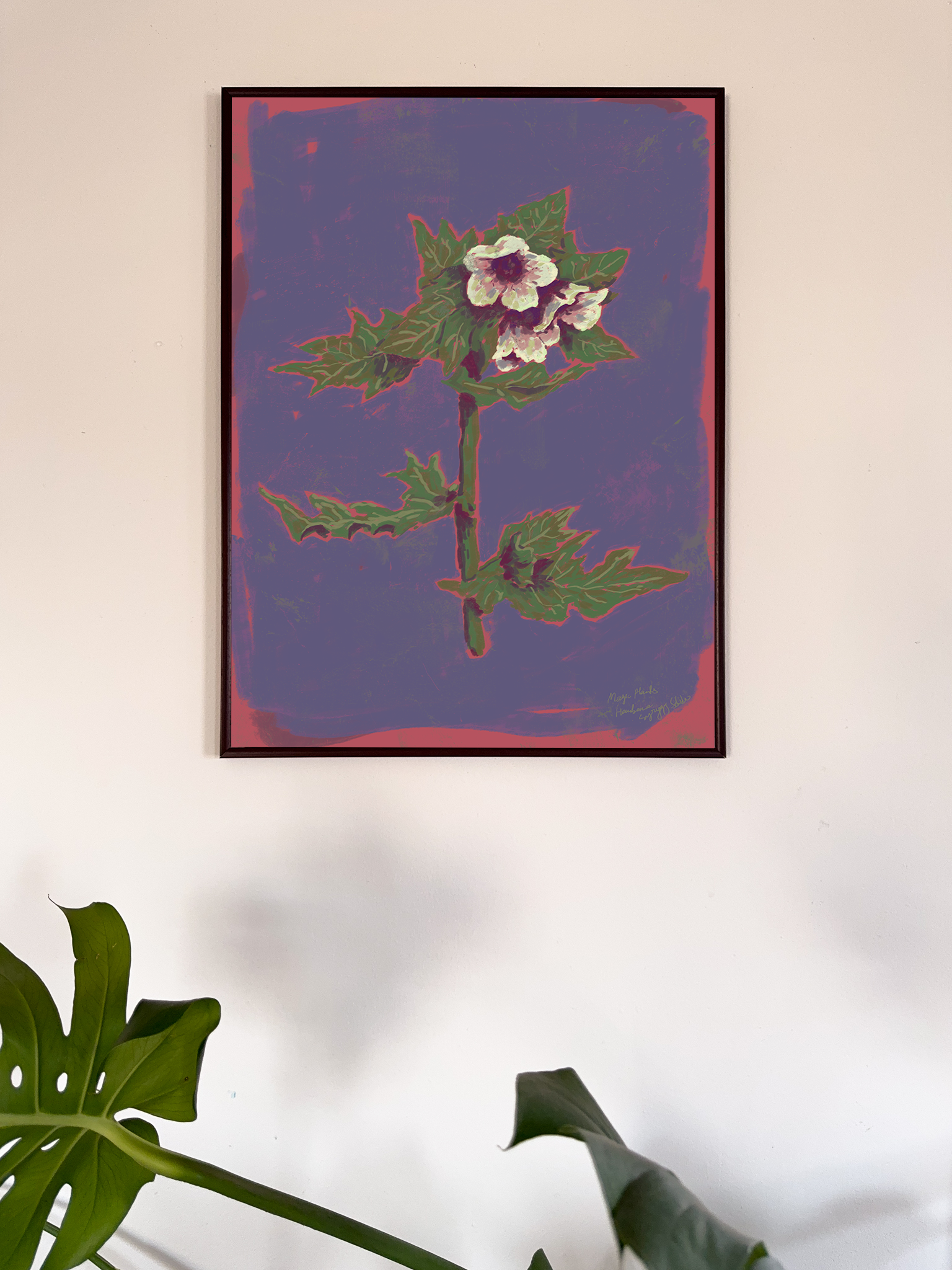 Framed artwork of a floral design on a purple background, hanging on a wall.
