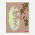 Framed artwork with a mirror reflection and leaves on a pink background