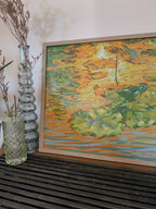  Artwork of water lilies on a wooden surface with decorative vases.