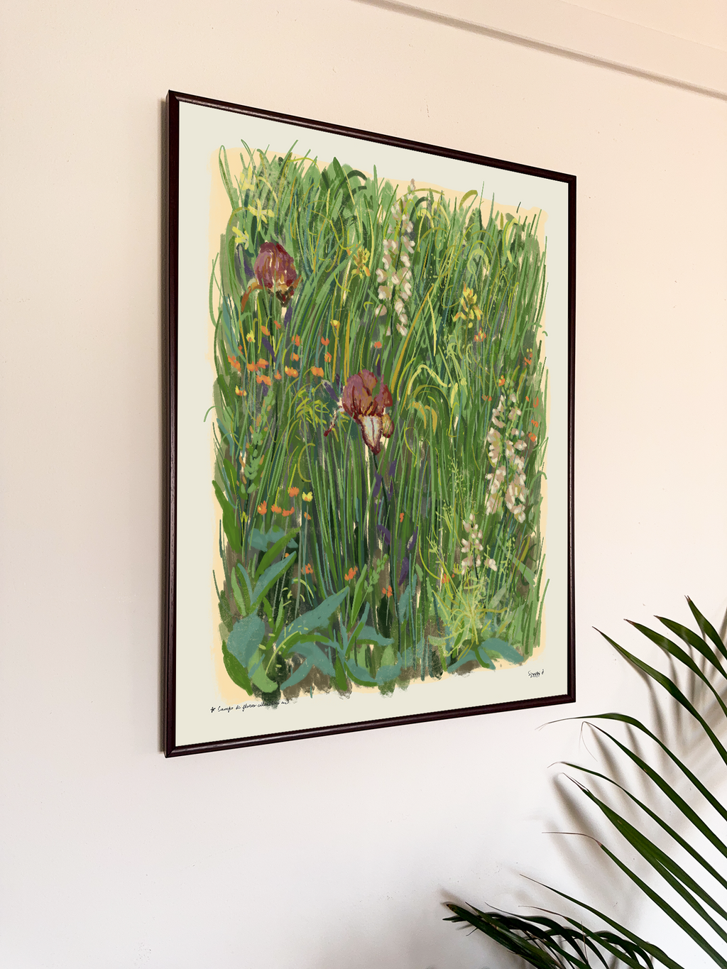 Framed artwork of a garden scene with flowers and plants on a wall.