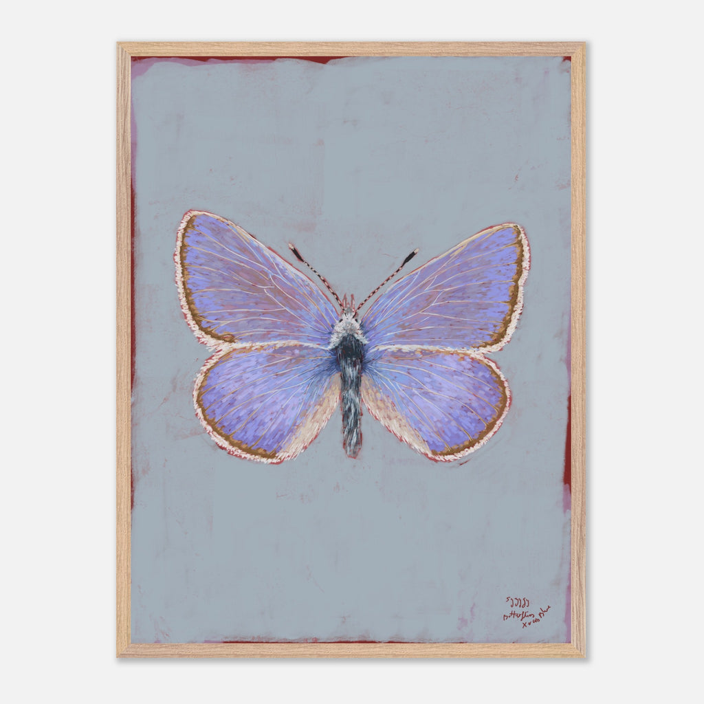Framed artwork of a butterfly on a light blue background