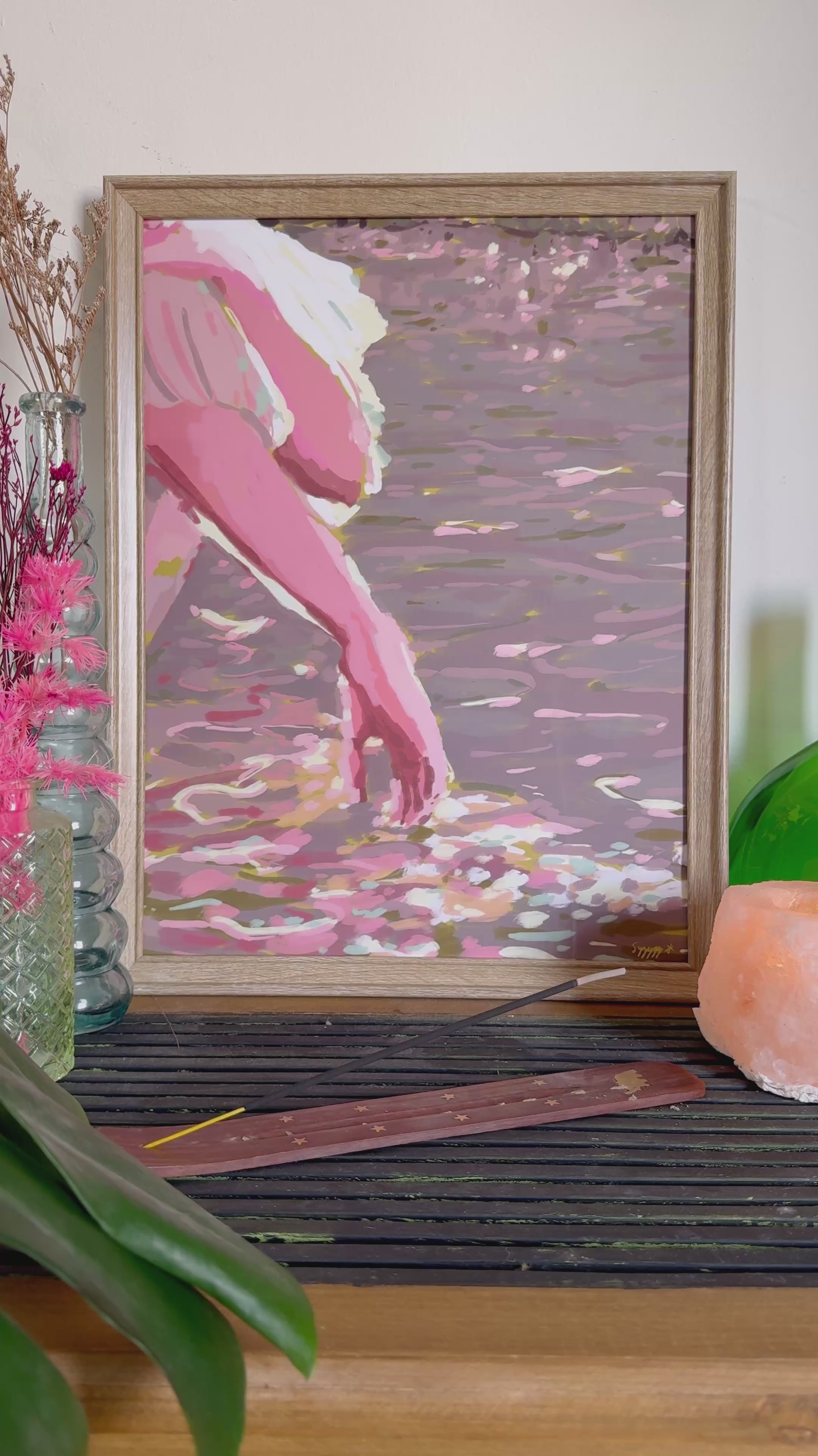 Video of mpressionistic art print of a hand touching the water from a boat and sunbeams reflections