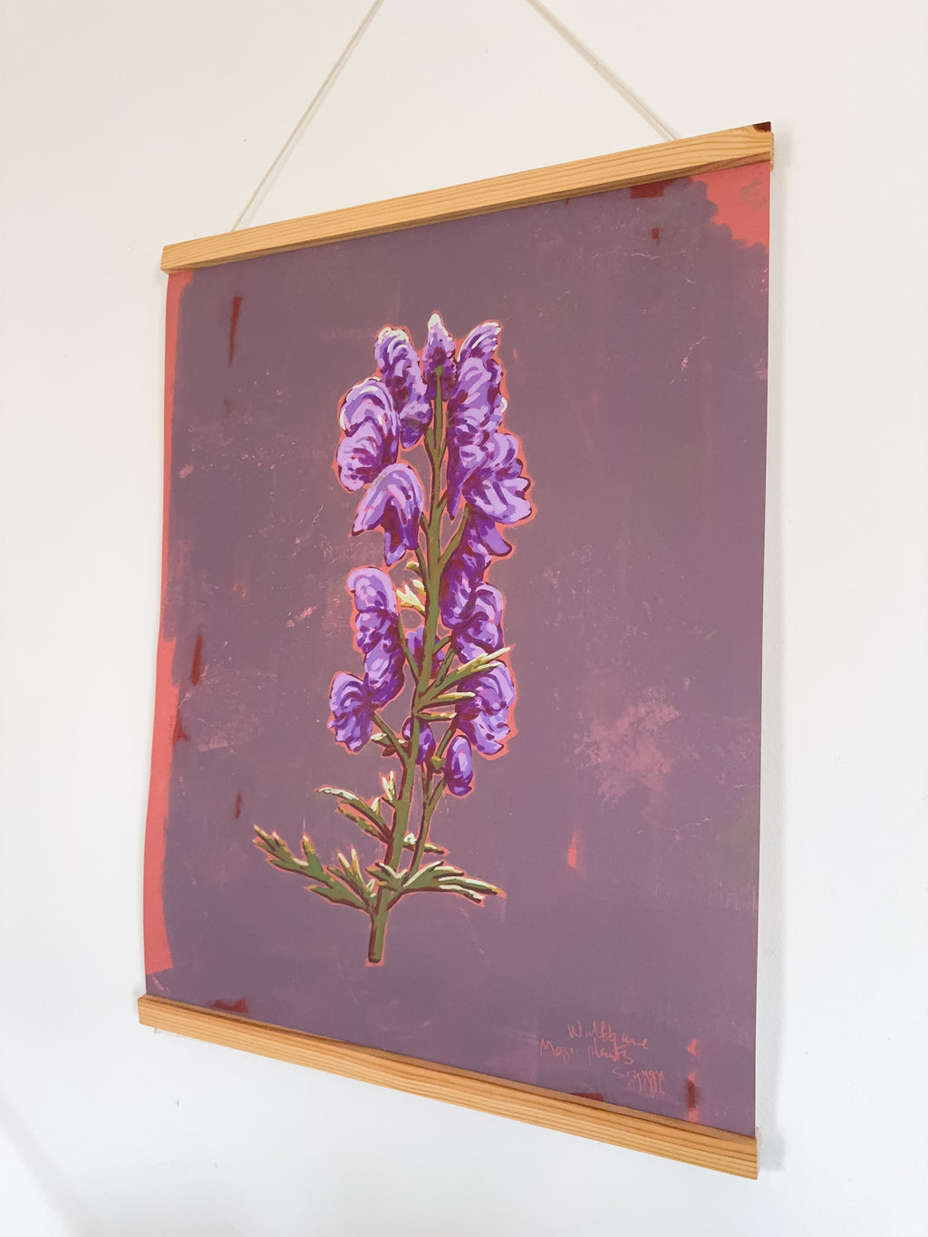 Artwork of a purple flower on a textured purple background with magnetic hanger
