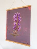 Artwork of a purple flower on a textured purple background with magnetic hanger
